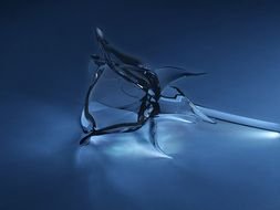 photo of a crystal rose on a blue background