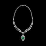 silver necklace with green gemstone