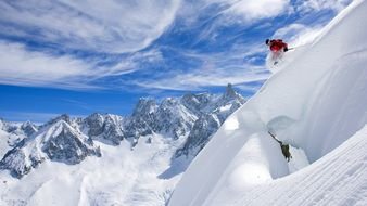 athlete descends from the snowy slope of the mountain