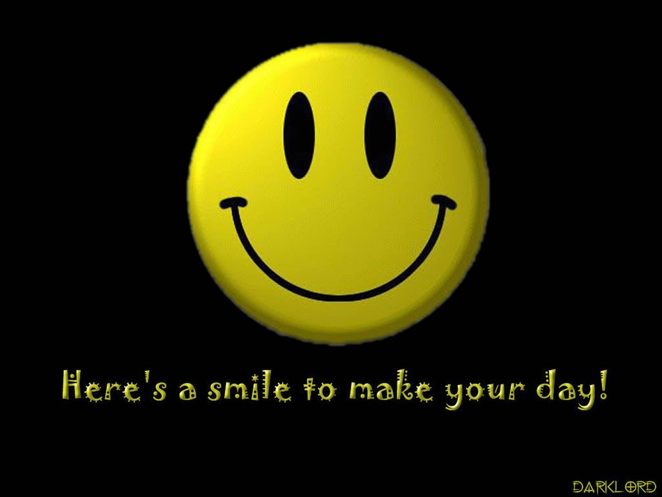 dark desktop wallpaper with a smiley face