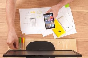 phone and monitor and pen