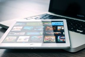 macbook, ipad on laptop computer