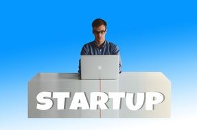 a man with a laptop on a blue background