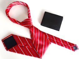 tie and wallet on a white background