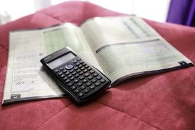 digital calculator on the sofa