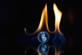 Photo of coin and flame