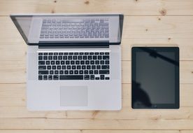 wooden desk laptop tablet computer