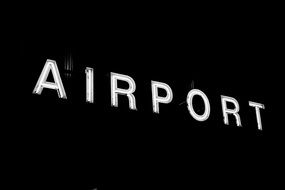 airport sign at night