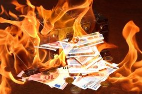 Money from treasure chest in fire