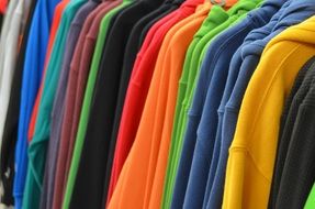 sweatshirts of different colors at the exhibition