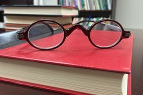 spectacles on the red book