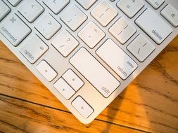 keyboard on a wooden table