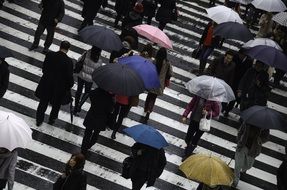 Busy people in Osaka at rainy day