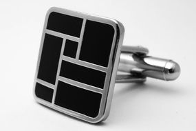black cufflink with lines