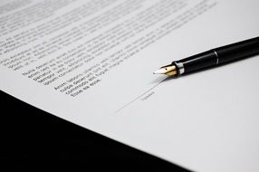 document-contract and a pen on a black background