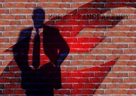 transparent silhouette of a businessman on the background of a brick wall