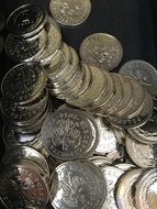 Shining coins on a black background