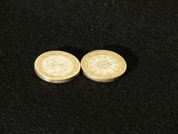 coins on a black surface