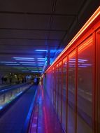 handrails and the wall along the moving walkway