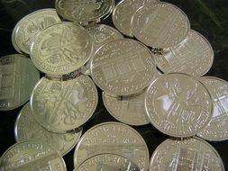 silver coins on a black background close-up