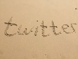 word twitter on the sand