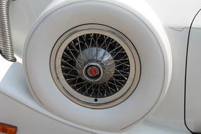 vintage white luxury car spare wheel