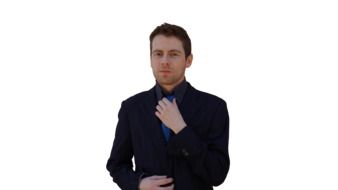 man straightens blue tie