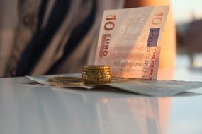 coins and euro banknotes are on the table