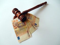 hammer and euro bills