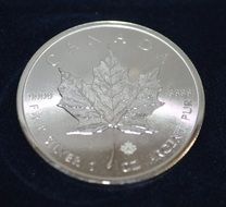 silver coin on a black background