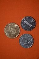 three silver coins