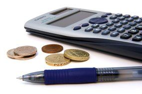 calculator money and pen