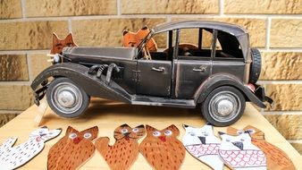 vintage toy car and cartoon figures
