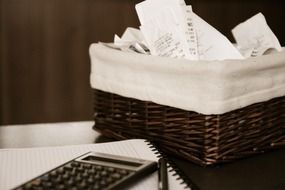 basket check, calculator and notebook for entries