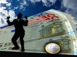 silhouette of a joyful businessman on a euro background