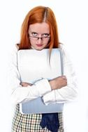 red haired woman holding laptop