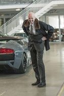 stylish businessman in the car showroom