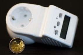 energy meter and euro coin