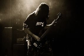 rock musician in a dark room