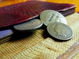 coins and burgundy wallet