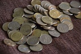 scattered coins on the tablecloth