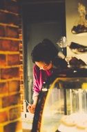 working woman behind the counter