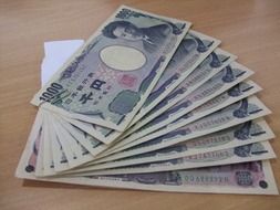 japanese money on wooden table