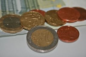 euro coins on euro bills