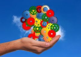 Clipart of the colorful gears in a hand