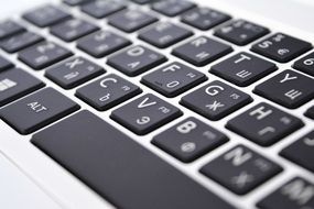 black buttons on a white keyboard