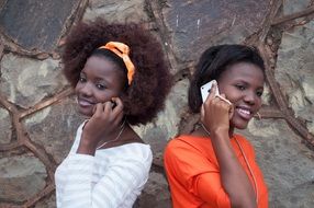 two african girls with mobile phones