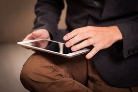 ipad at manâs hand