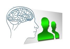 Human brain and green silhouettes of people