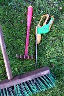 garden tools on green grass